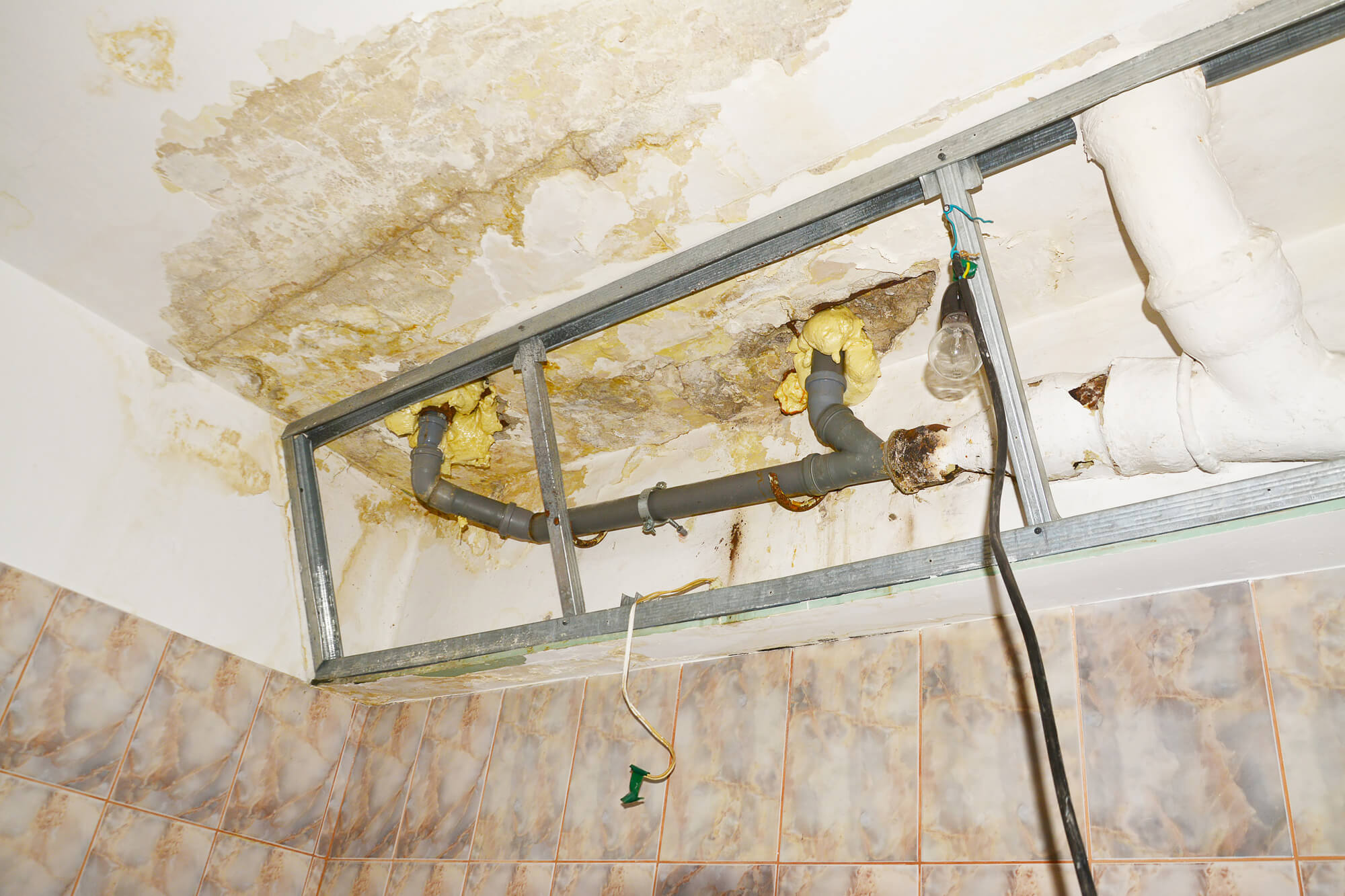 Damaged roof in need of water damage restoration in texas