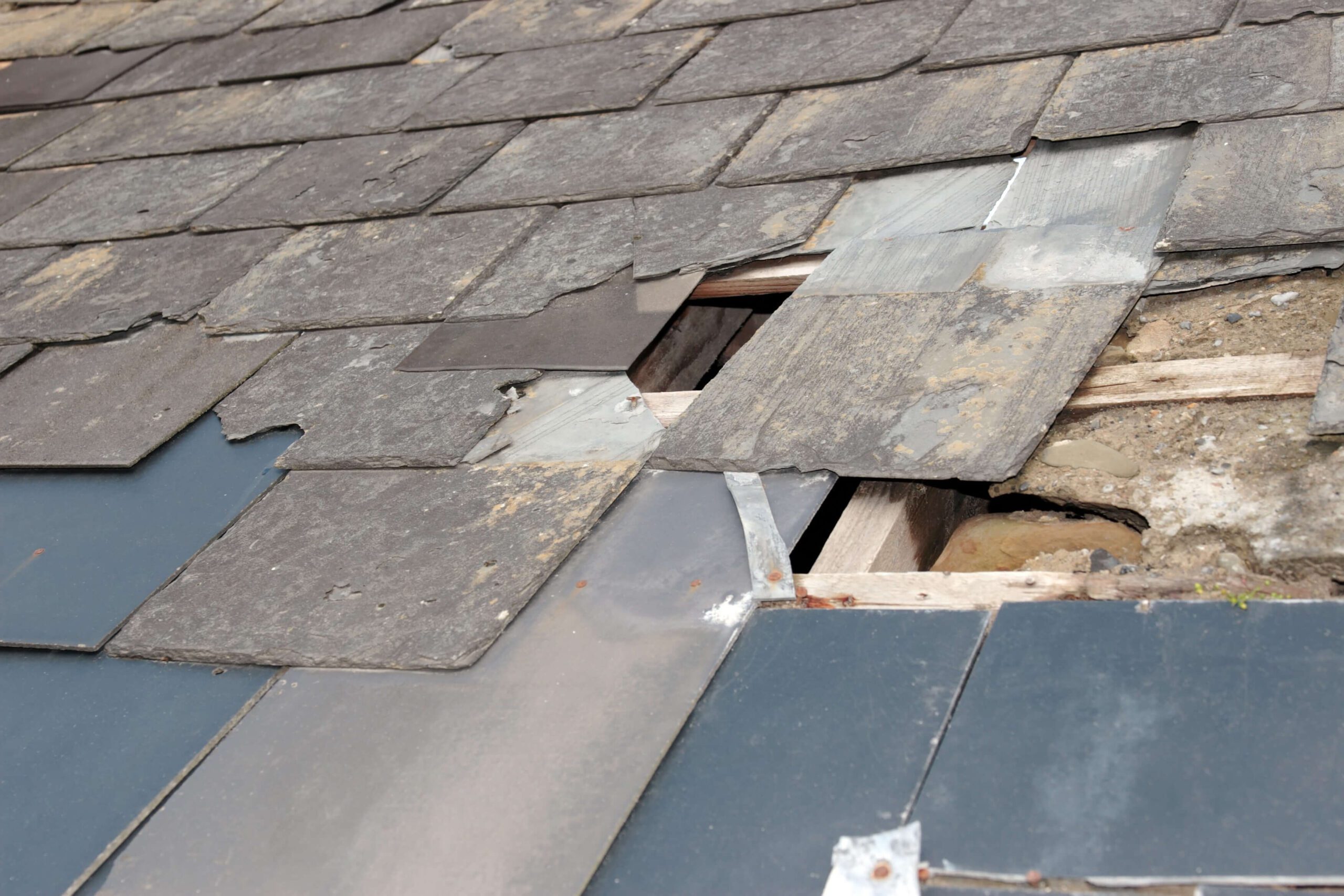 broken roof in need of multifamily roofing services