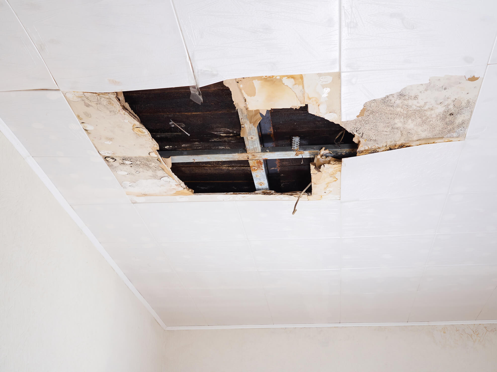 ceiling with water damage in need of multifamily facility restoration