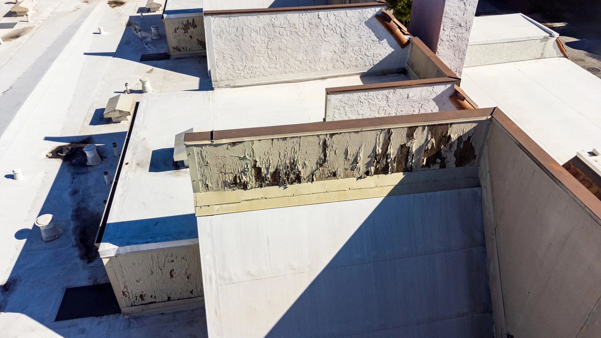 damaged commercial roof needs commercial roof leak repair