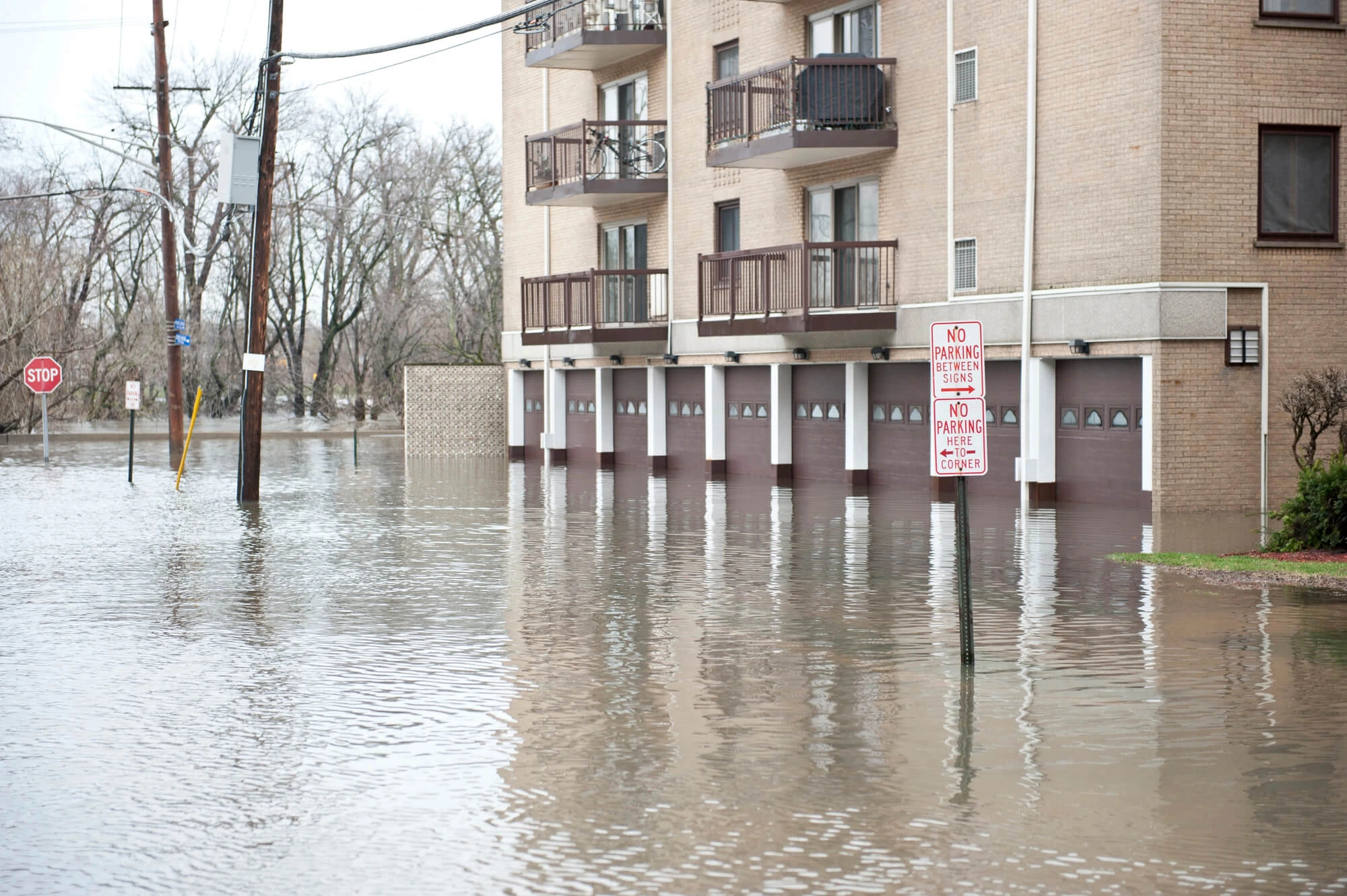 flooded street and building in need of commercial flood restoration