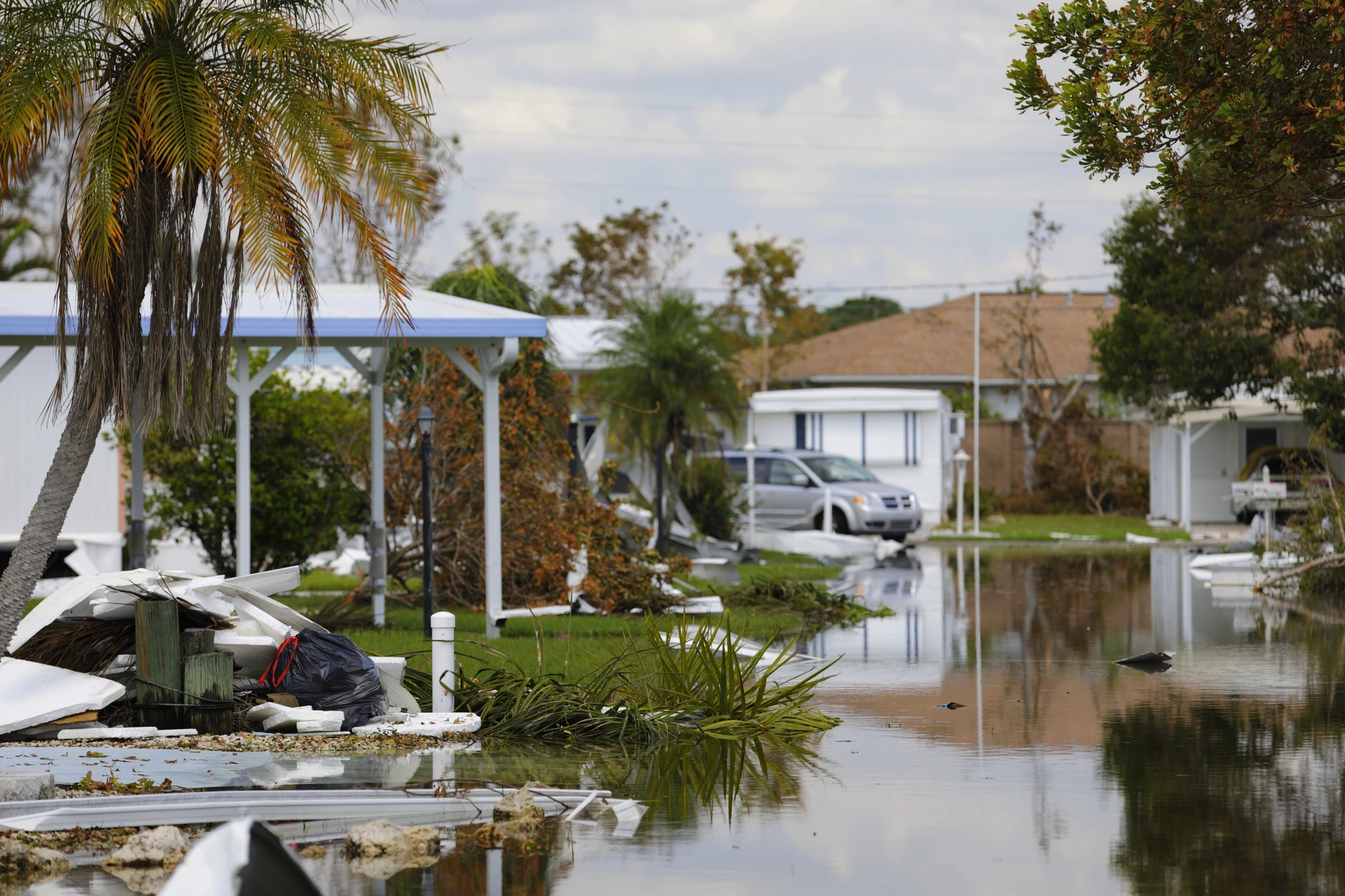 damaged street needs storm damage repair