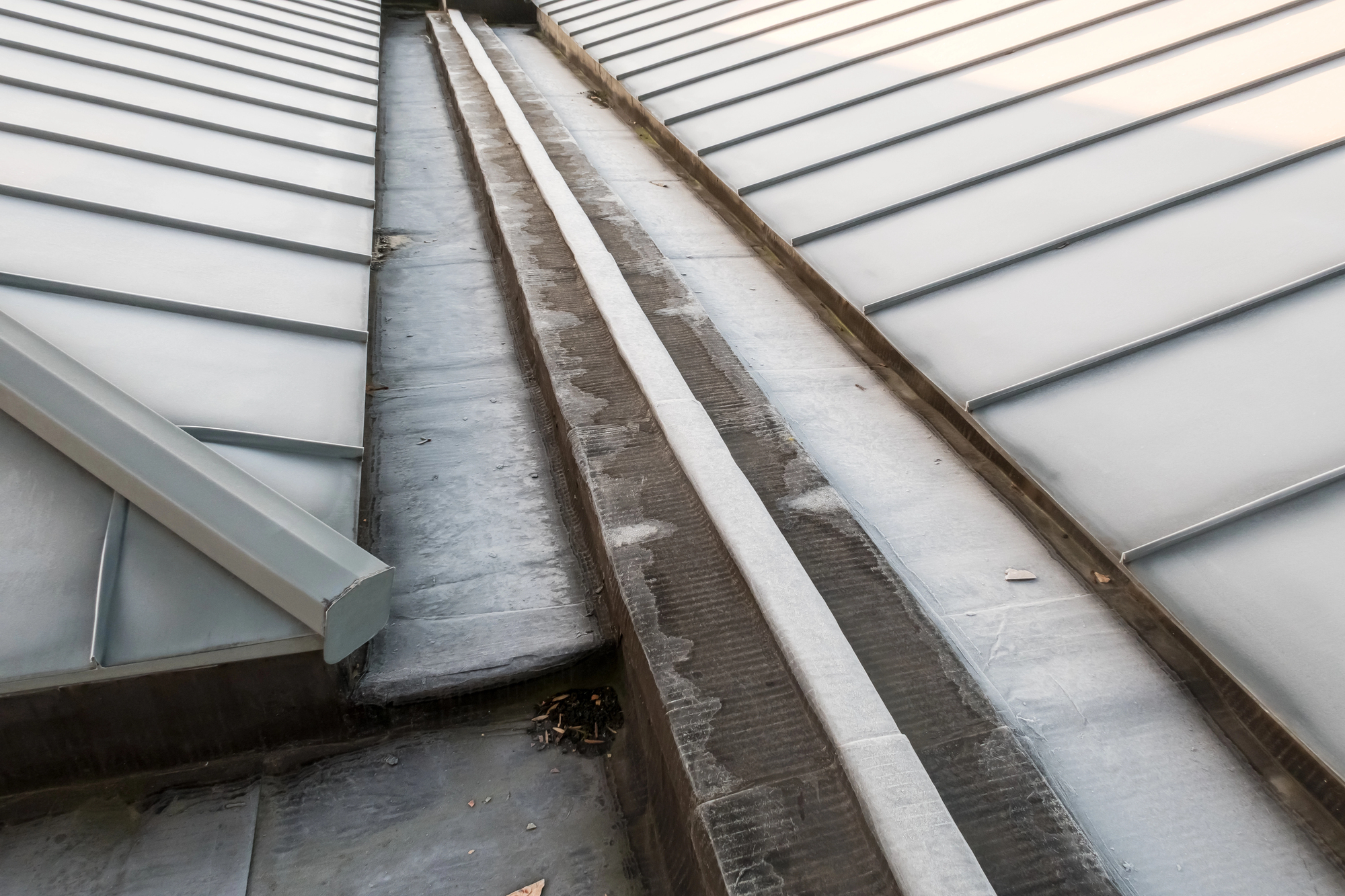 gutters and commercial roofing covered in snow