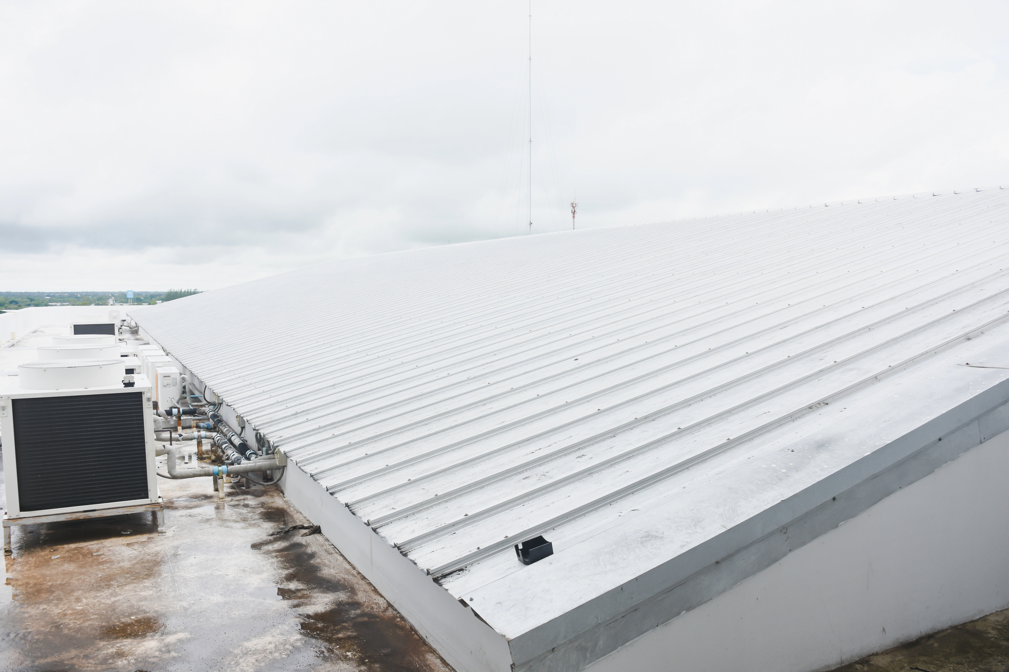metal commercial roofing with snow