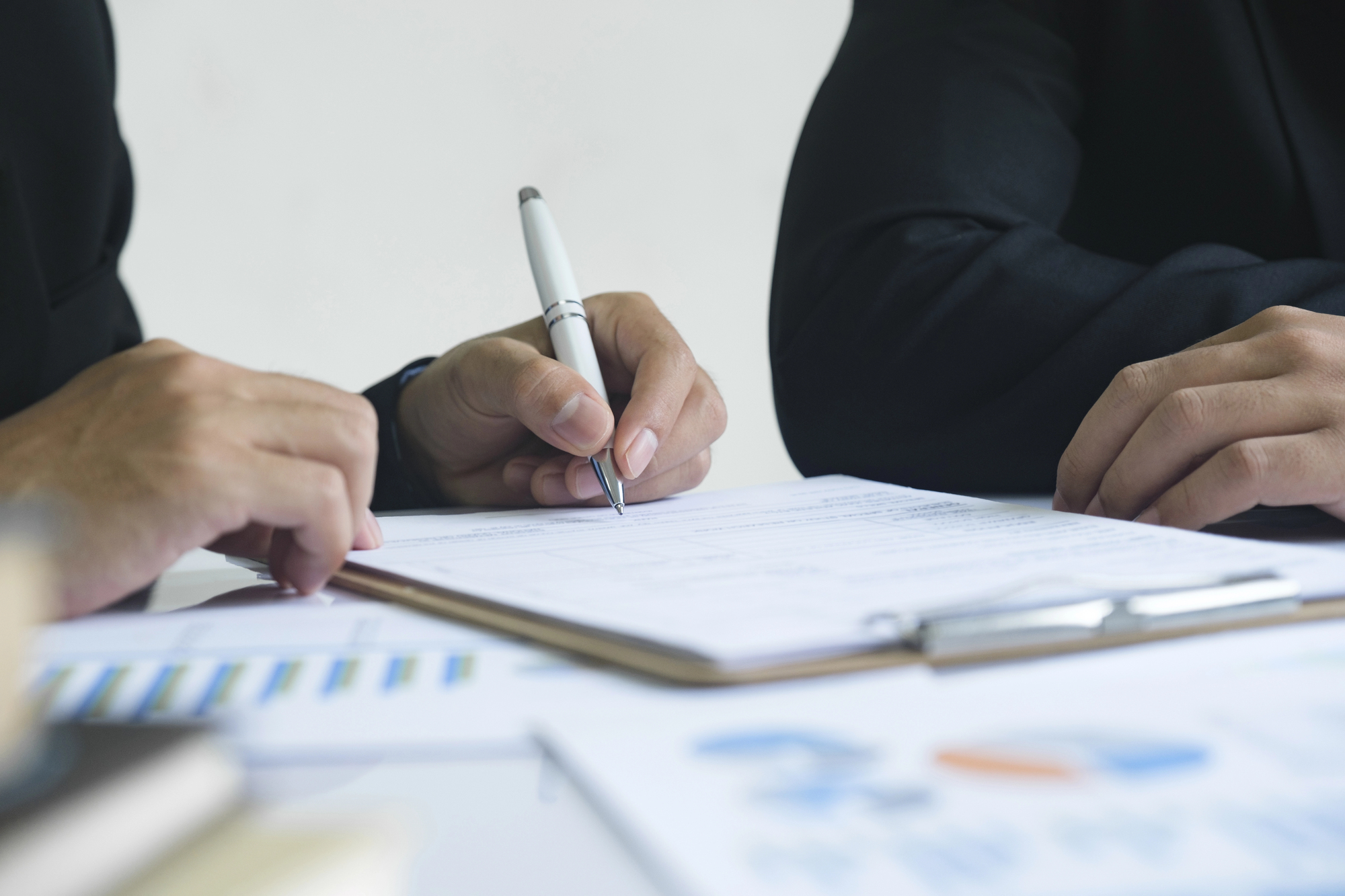 people writing and doing capital planning with commercial contractors